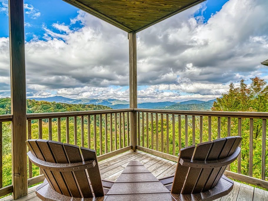 Outdoor deck with a beautiful mountain view on a cloudy blue sky day